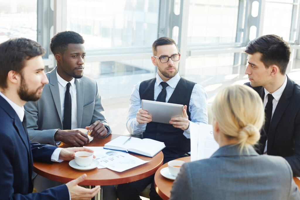 2020 search partners, A group of professionals having a meeting