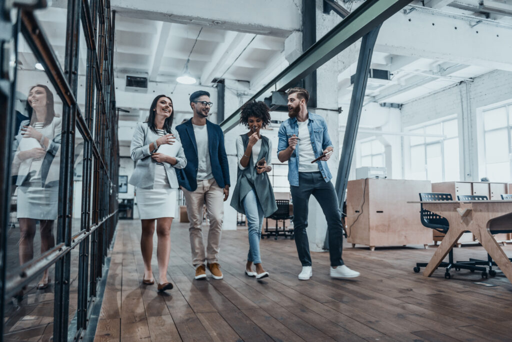 2020 search partners, Four business professionals walking together